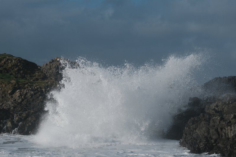 Waves crash against a cliff in Derry.