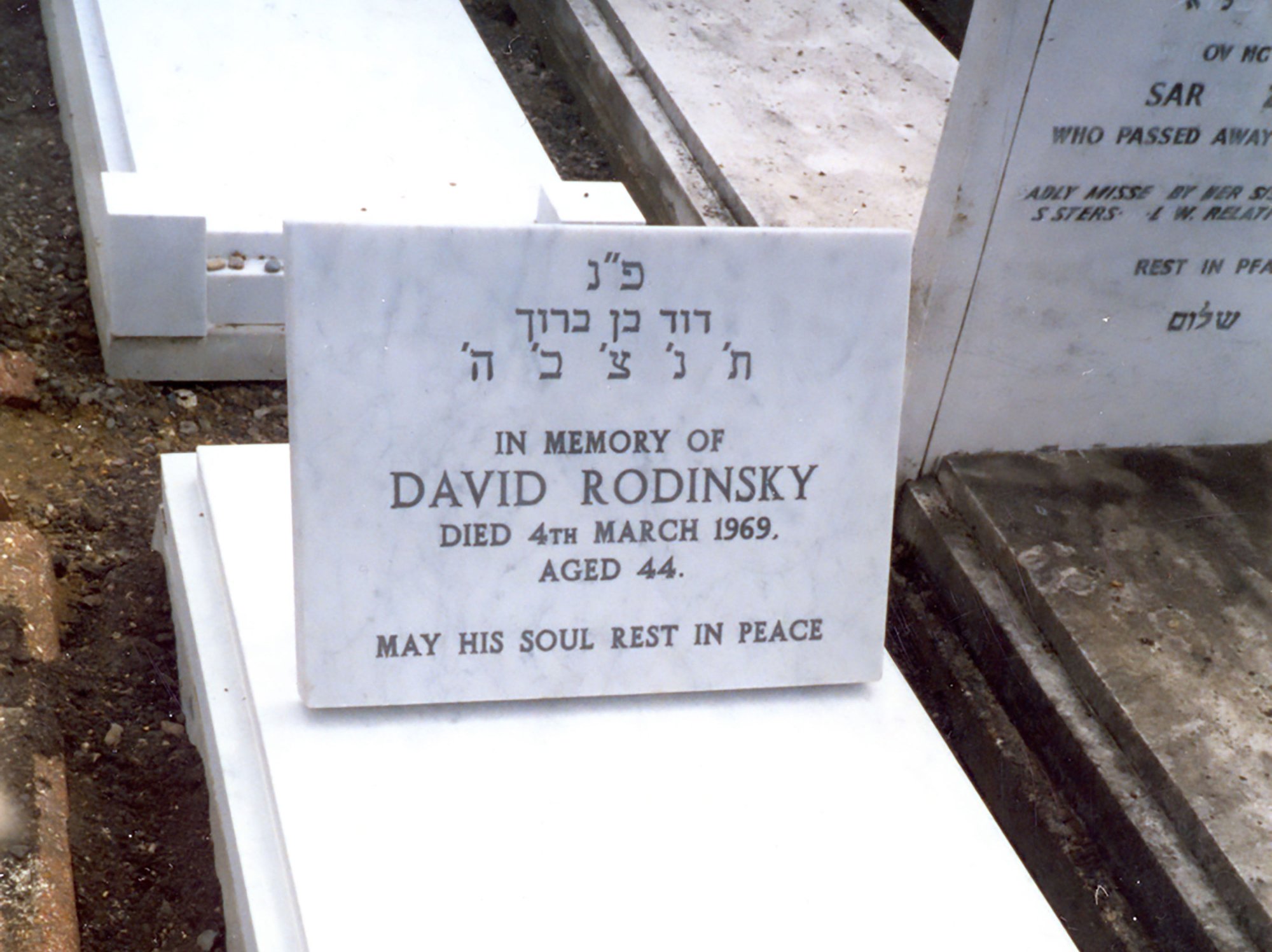 Image: David Rondinsky's headstone, that Rachel Lichtenstein commissioned Elfes stonemasons to create, being laid in 1999. Photograph: Rachel Lichtenstein1999. Photograph: Rachel Lichtenstein