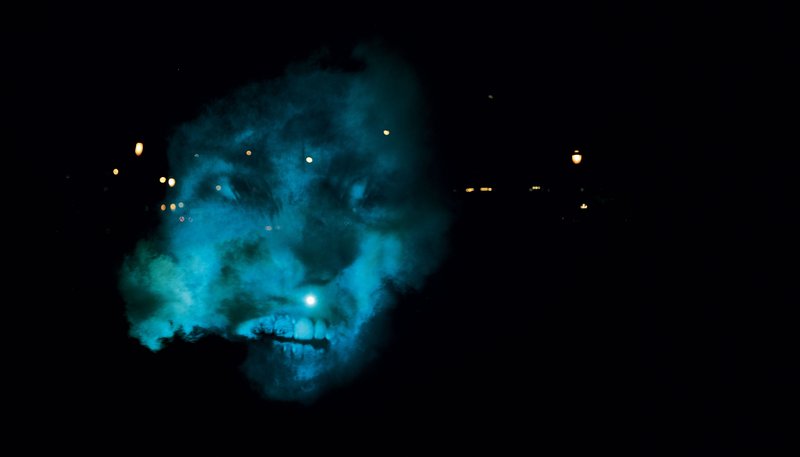 Image: The Medium projected onto a smoke during The Influence Machine in Soho Square, 2000. Photograph: Dennis Cowley