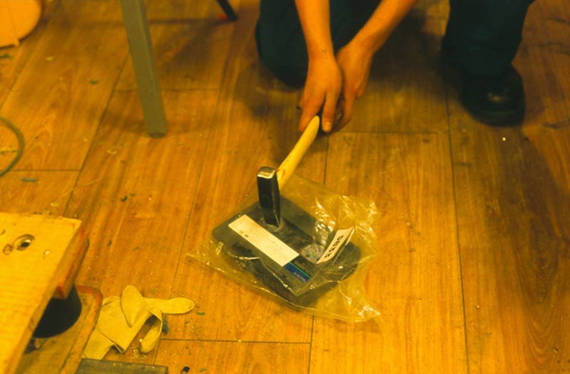 Image: An operative uses a hammer to destroy a videotape included in Michael Landy's inventory during Break Down, 2001.  Photograph: Parisa Taghizadeh
