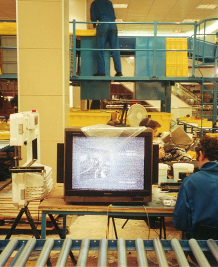 Operatives at work on the factory line, meticulously destroying Michael Landy's inventory during Break Down, 2001. Photograph: