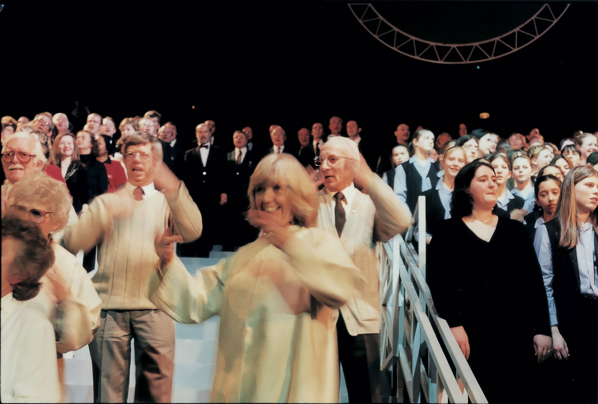 Image: The choirs perform during the Roundhouse performance of Because I Sing, 31 March, 2001. Photograph: Phil Lea