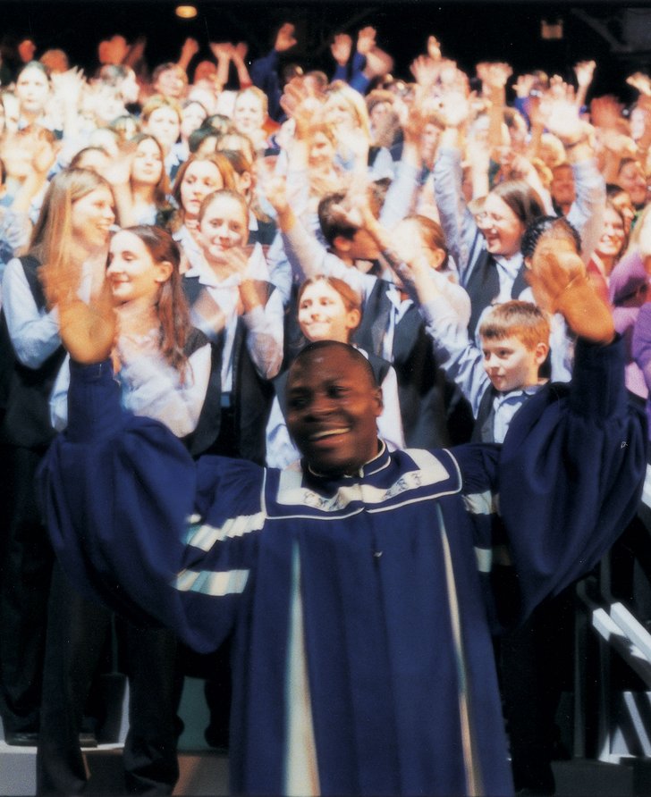 Image: The choirs perform during the Roundhouse performance of Because I Sing, 31 March, 2001. Photograph: Phil Lea