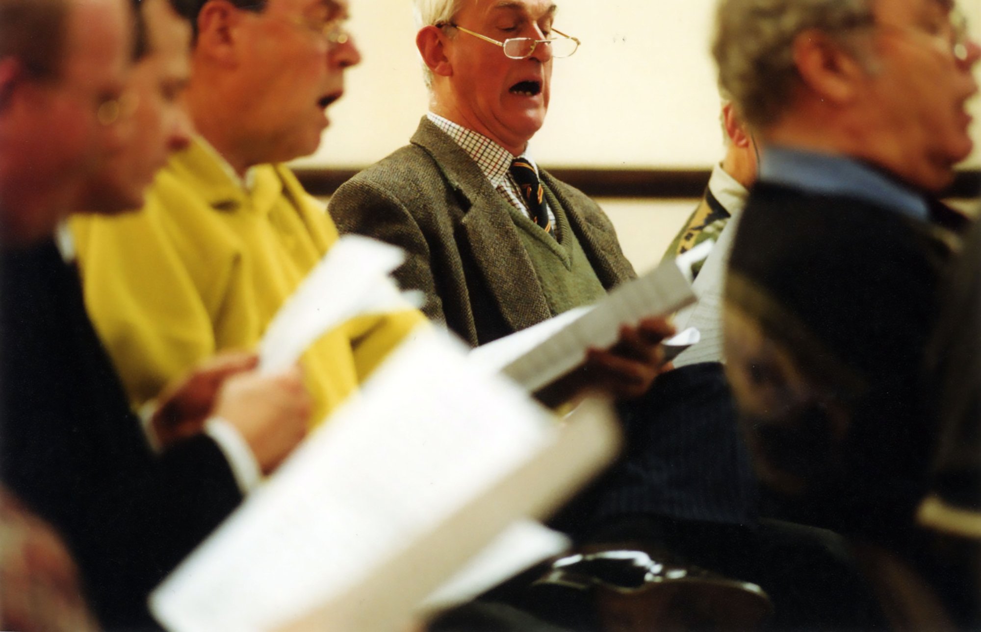 Image: Men from Gwalia, the Welsh male voice choir practice for their performance at Because I Sing, 2001. Photograph: Phil Lea