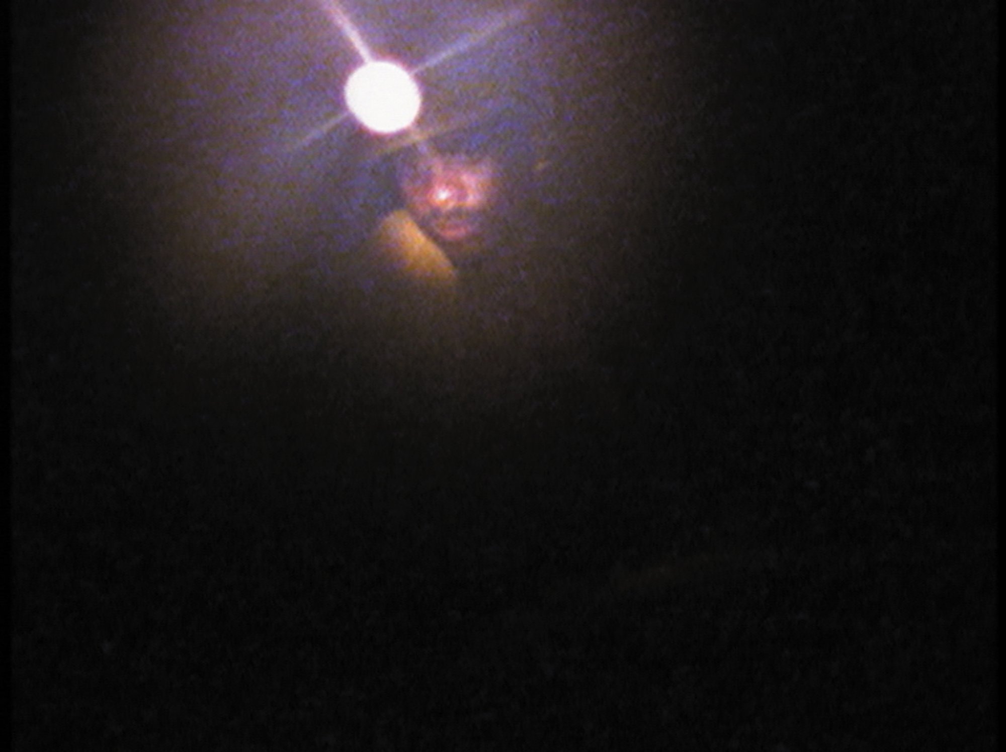 Still from Steve McQueen's Western Deep, 2002, depicting a miner in the TauTona mines in the Witwatersrand Reef near Johannesburg in South Africa.