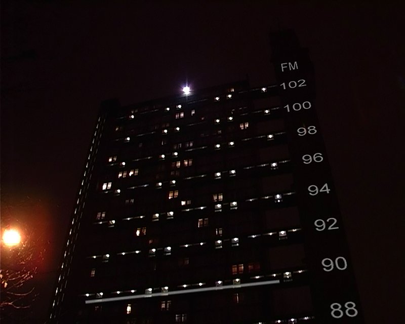 The Trellick Tower in west London at night, reimagined as a radio. Image by David Blandy, 2005.