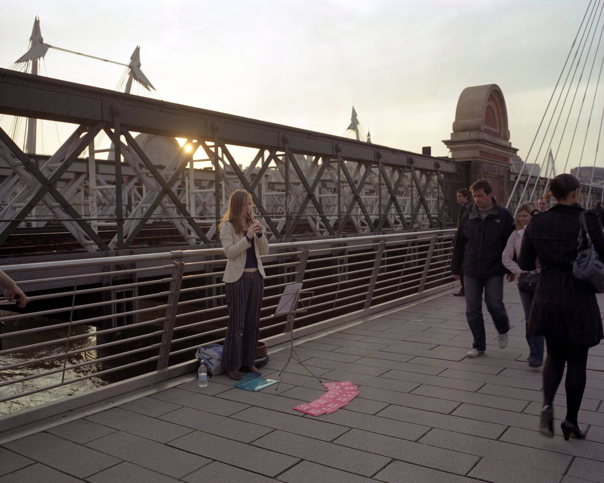 Performer Brona McVittie playing Ballad of Accounting on the bodhran on the Golden Jubilee Bridge, part of Ruth Ewan: Did you kiss the foot that kicked you? (2007). Photograph: Gautier Deblonde