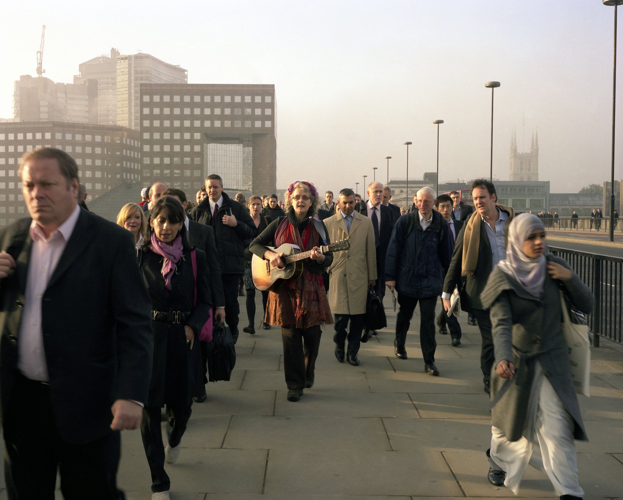 Performer playing Ballad of Accounting on the guitar, part of Ruth Ewan: Did You Kiss the Foot That Kicked You? (2007). Photograph: Gautier Deblonde