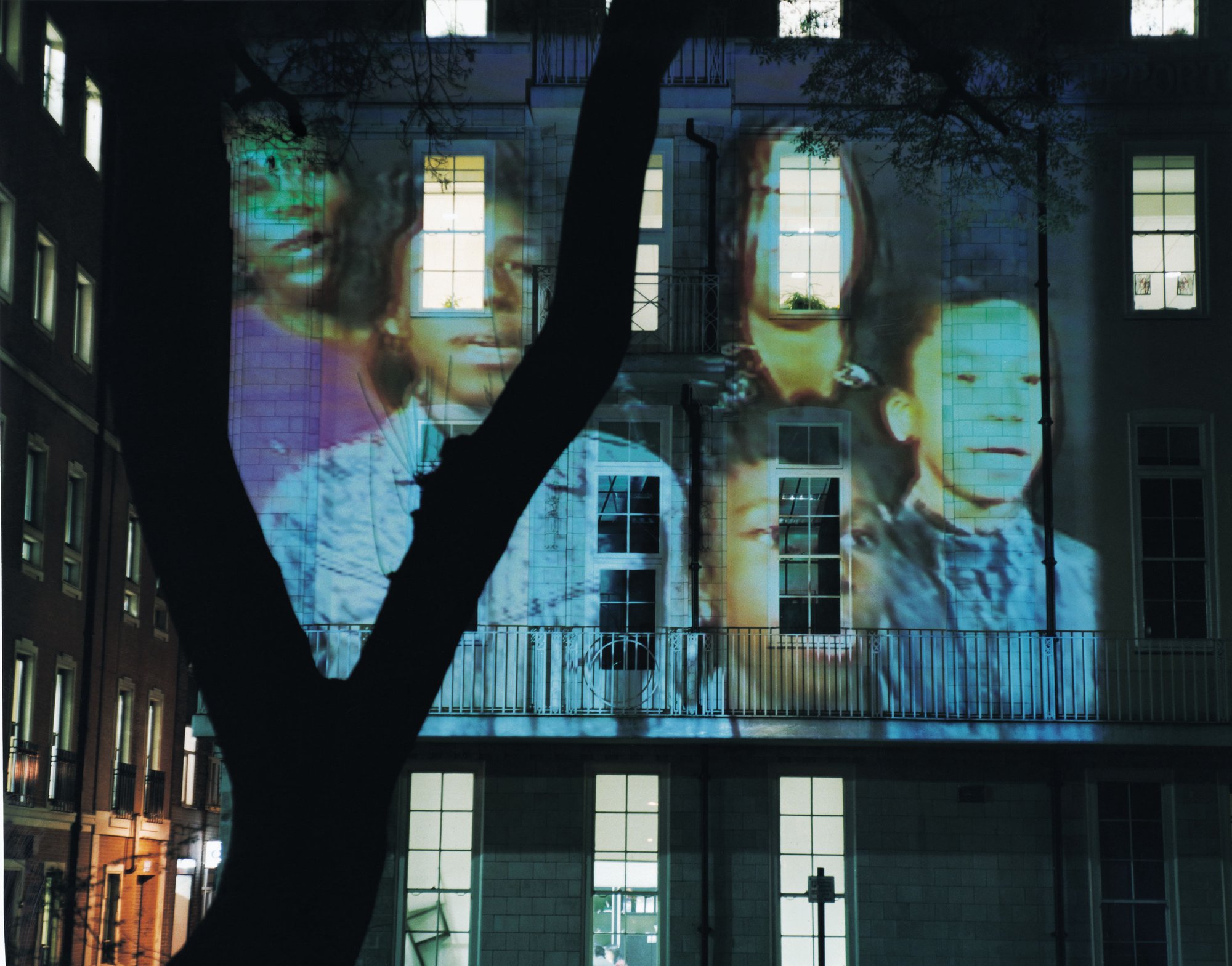 Images: Children projected onto a building during The Influence Machine in Soho Square, 2000. Photograph: Dennis Cowley