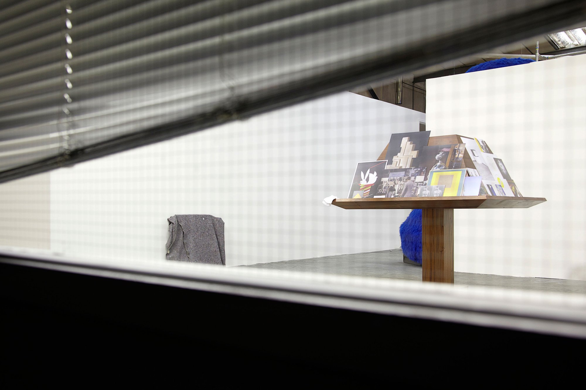 Image taken through window of Ryan Gander's Locked Room Scenario exhibition at Londonnewcastle Depot in 2011. Image by Julian Abrams.