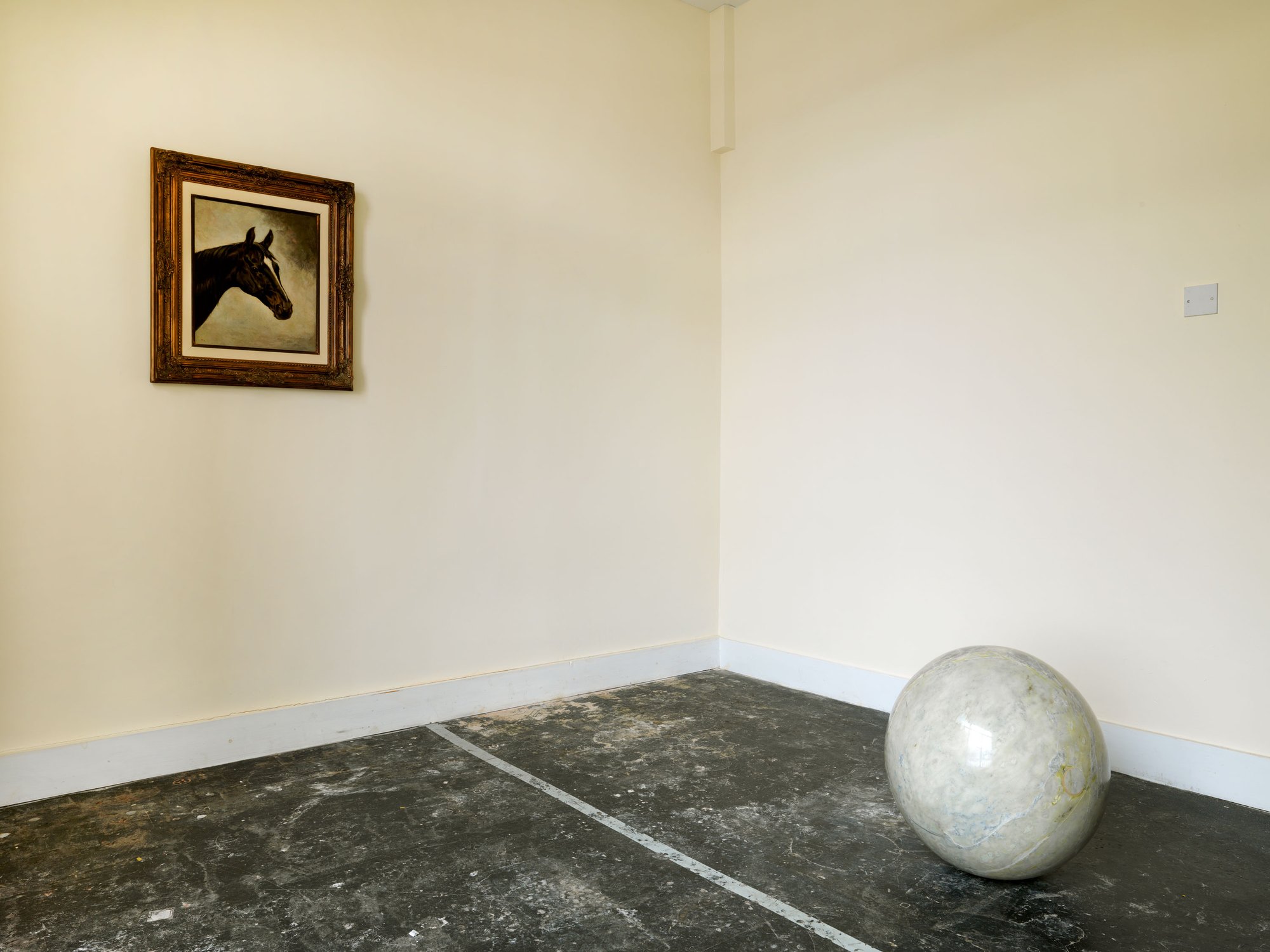 A found painting of a horse, that travelled with Damasceno from Brazil to London, and marble sphere are to be found in a room marked Private on the fourth floor of the library. Part of José Damasceno's Plot (2014). Photograph: Marcus Leith