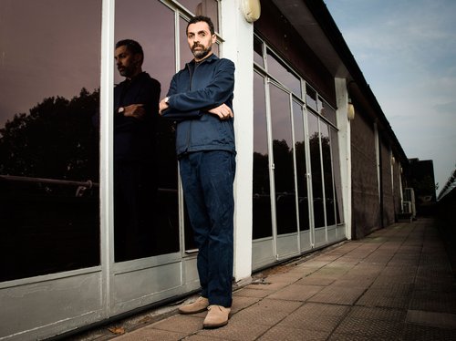 José Damasceno standing on the balcony on the 4th floor of Holborn Library during production of his project Plot (2014). Photograph: Tom Oldham