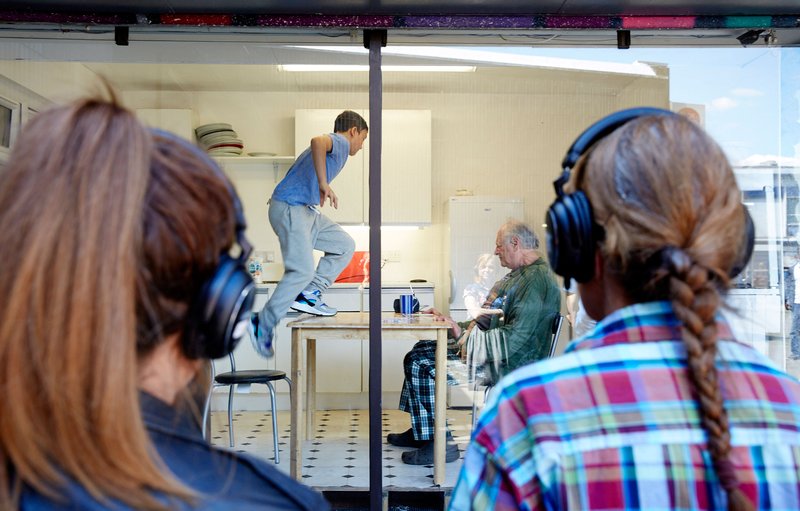 The kitchen part of Lu Kemp's Have Your Circumstances Changed? seen from behind the audience, June 2015. Photograph: Manuel Vason