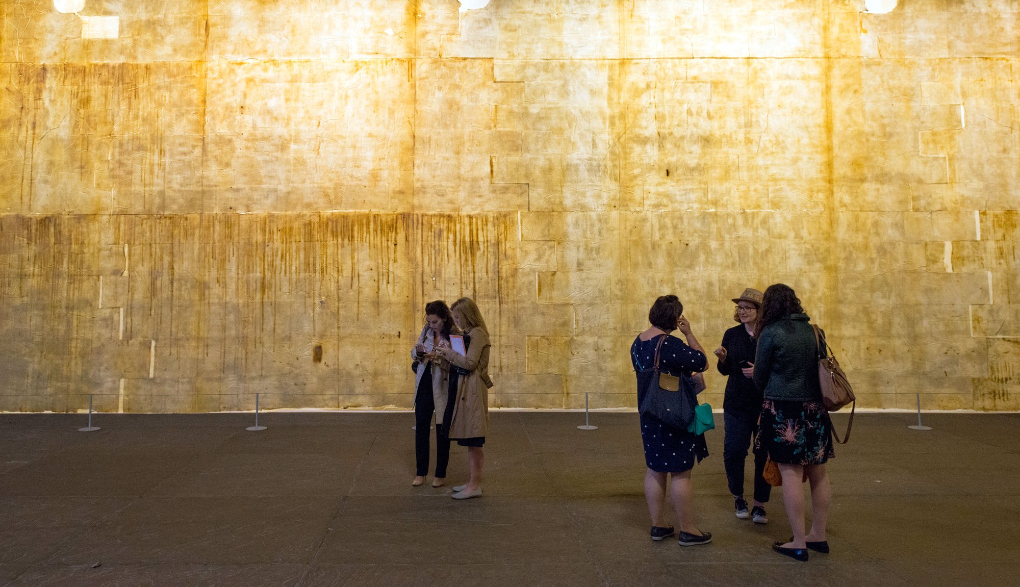 People in front of  The Ethics of Dust at the opening event in Westminster Hall, London (2016). Photograph: William Eckersley