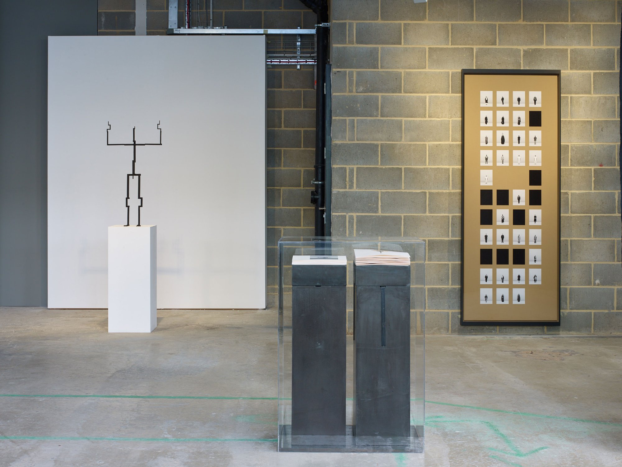 Left-right: Antony Gormley's bronze sculpture TRANSMIT  II  (1/2  SCALE  ROOTER) II, 2017; Taryn Simon's Paperwork and the Will of Capital, Press XII, 2015; and Taryn  Simon's  Professional  Mourners,  2018. Photograph: Stephen White.