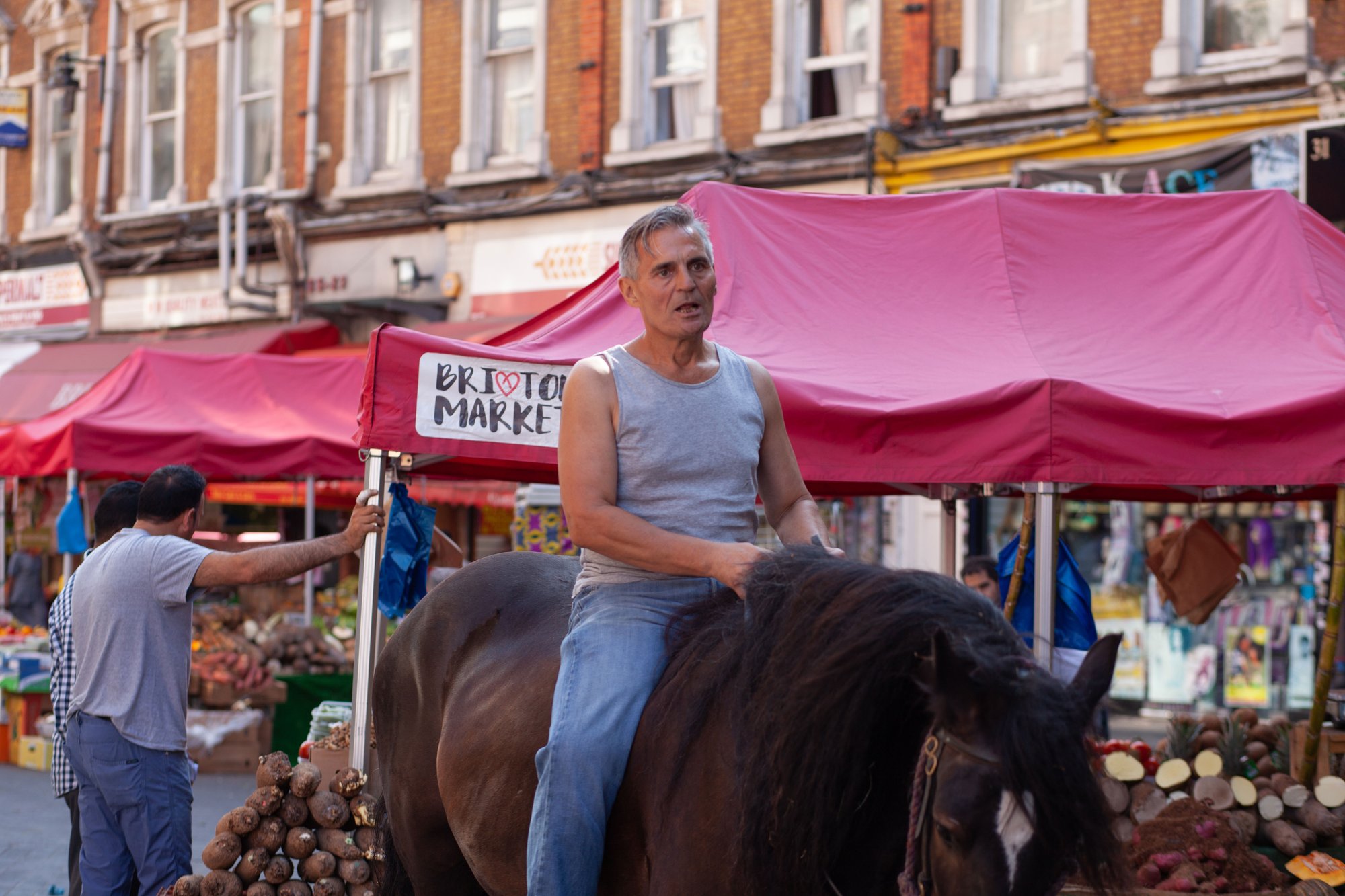 Patrick Onione on a horse in Brixton Market on set for Here for Life. Photo: Marc Hankins