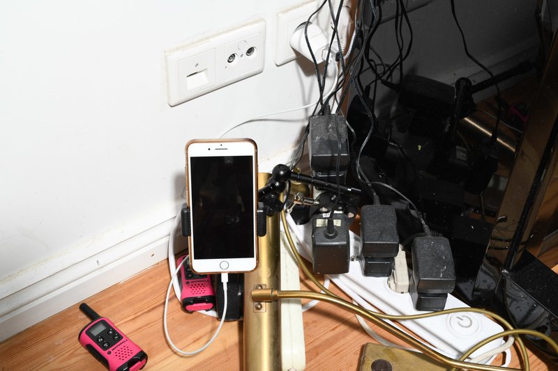 A phone plugged in and set up ready to run Red Lines. Photograph: Tobias Faisst