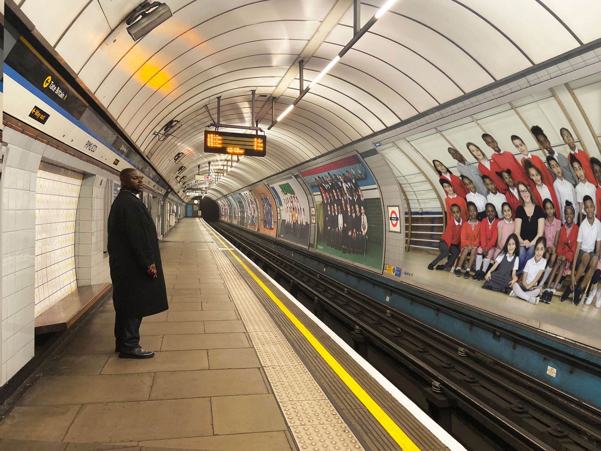 Steve McQueen on the Victoria line platform at Pimlico Underground station viewing his work Year 3. Photograph: Clare Morris. Year 3 is a partnership between Tate, Artangel and A New Direction.
