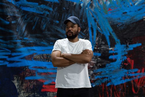 Oscar Murillo in front of his artwork. Photograph: Julian Valderrama, September 2020. Courtesy the Artist and David Zwirner
