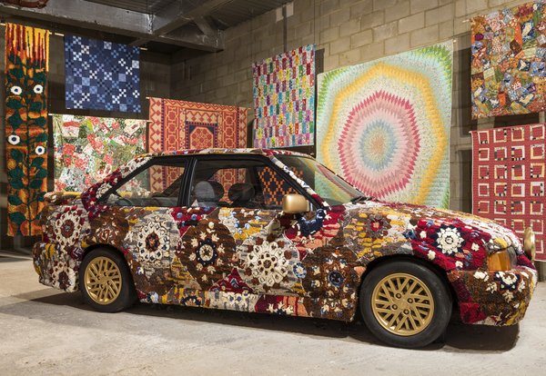 Hetain Patel, Somerset Road, 2024, installed next to quilts and carpets by hobbyists at Come As You Really Are. Photography by Thierry Bal.